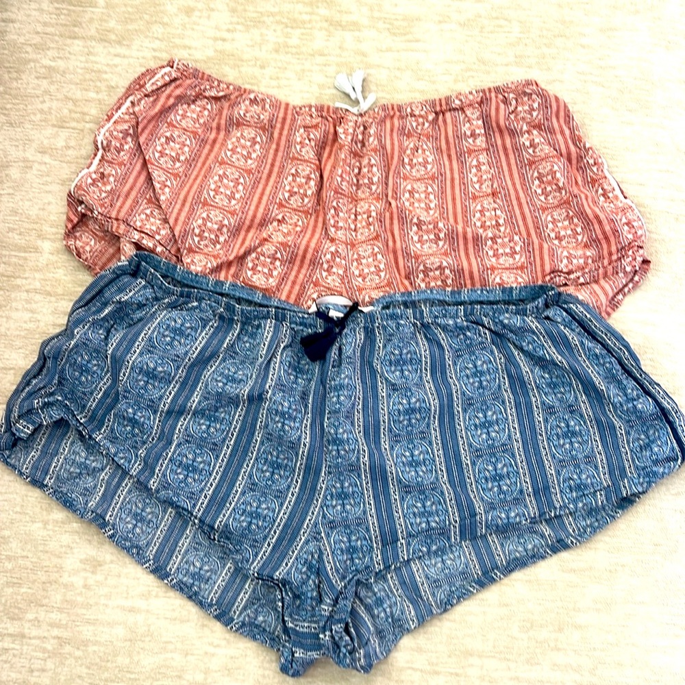 A set of two small Victoria Secret boy shorts in pink and blue